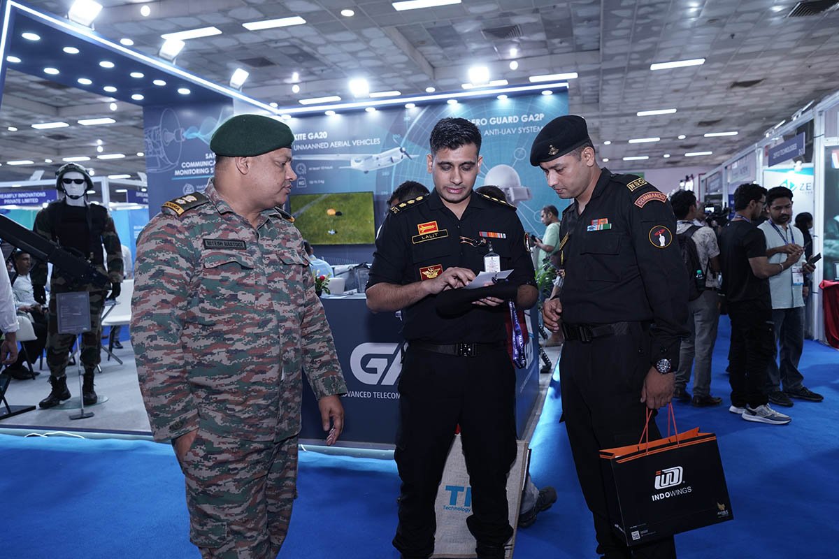 Defence personnel evaluating technology at the 2025 exhibition